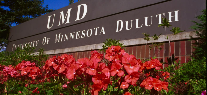 UMD sign with flowers in front of it